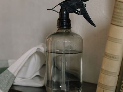 Close-up of a water bottle and a clean towel.