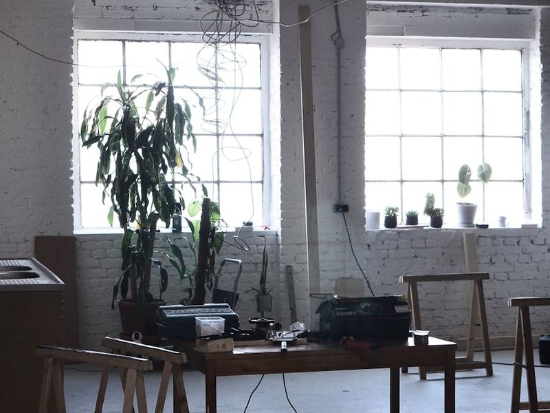 Minimalist exercise studio with large windows and natural light.